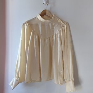 Cream blouse with puffy sleeves